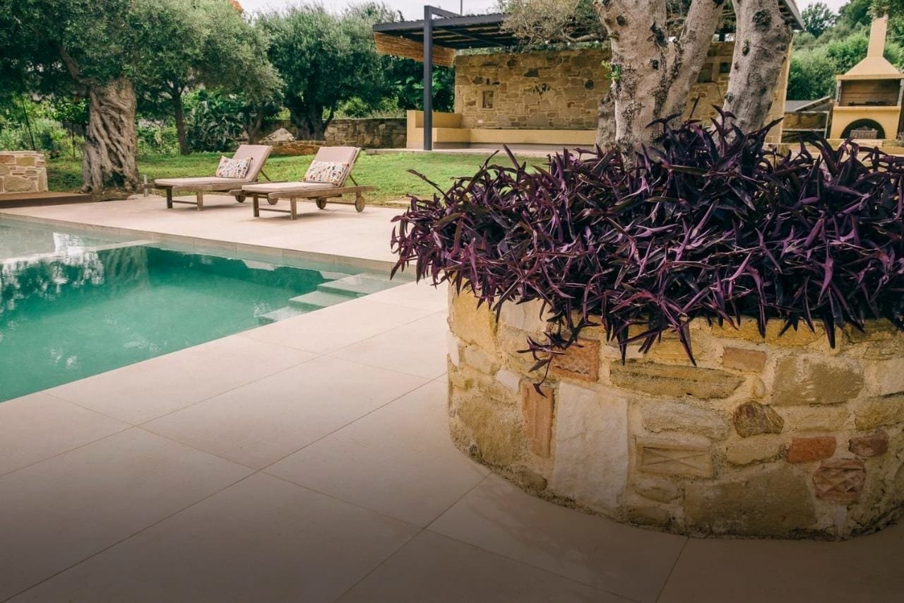The pool terrace of Ariti Villa at golden hour