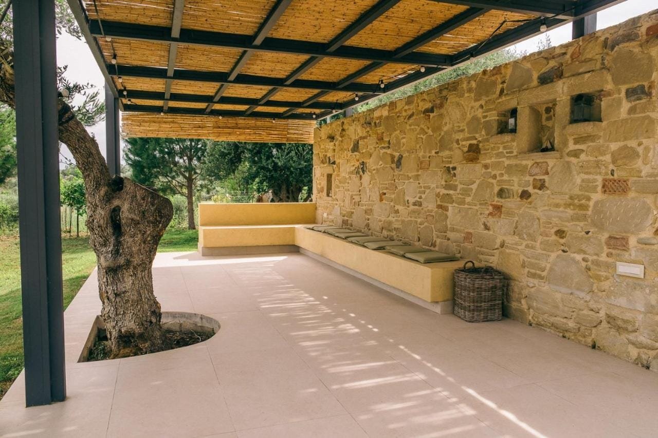 Covered terrace with stone walls